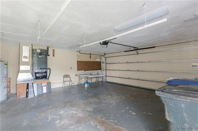 garage with electric water heater and a garage door opener