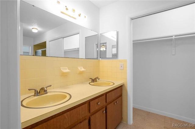 bathroom with vanity and backsplash