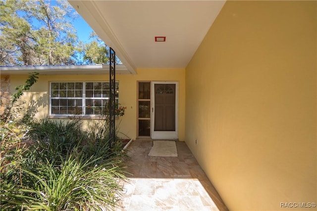 property entrance with a patio