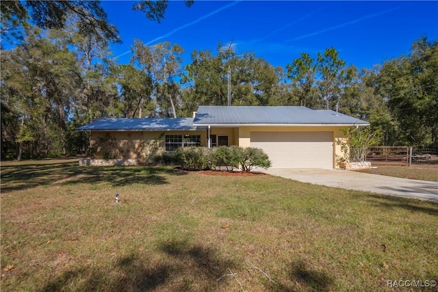 ranch-style house with a garage and a front lawn