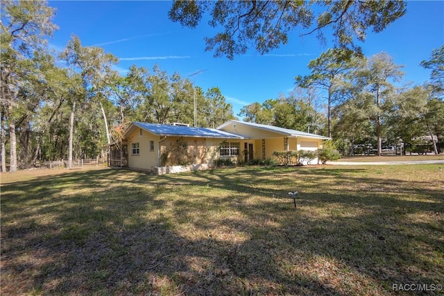 view of home's exterior with a lawn