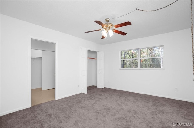 unfurnished bedroom with ceiling fan and carpet