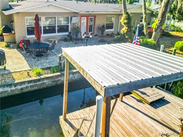 rear view of property featuring a patio area