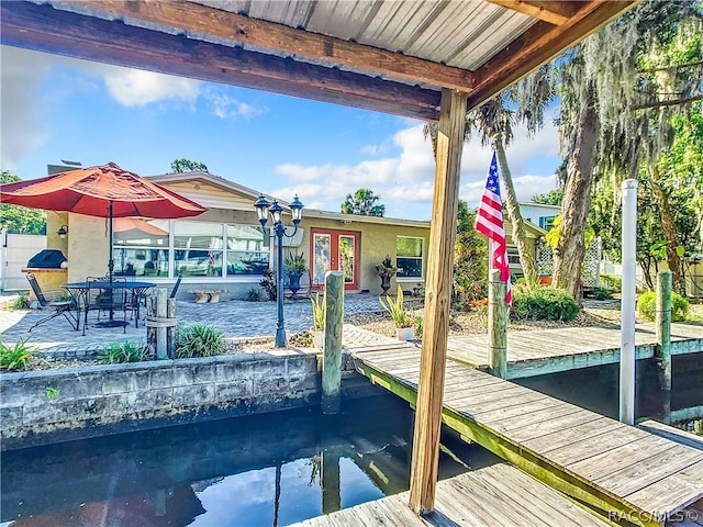 view of dock featuring a patio