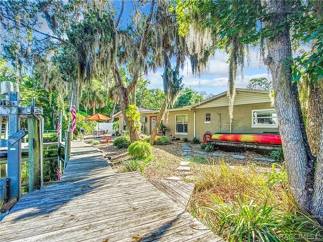 view of yard with a dock and a patio