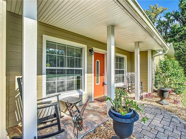 doorway to property featuring a porch