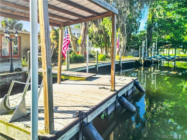 view of dock with boat lift