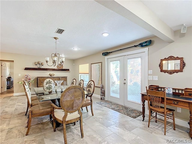 dining space with beamed ceiling, french doors, a textured ceiling, and a notable chandelier