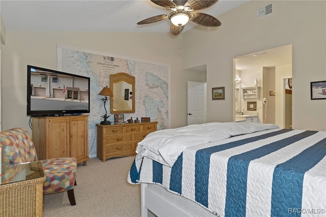 carpeted bedroom featuring ceiling fan, lofted ceiling, and connected bathroom