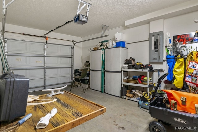 garage featuring electric panel and a garage door opener