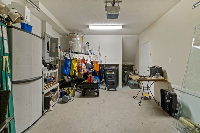 garage featuring electric panel, electric water heater, and a garage door opener