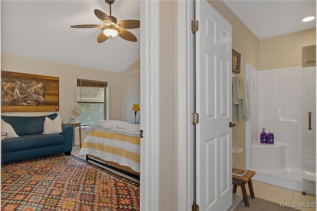 tiled bedroom with ceiling fan and vaulted ceiling