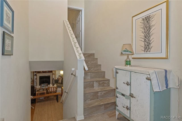 stairs featuring hardwood / wood-style floors