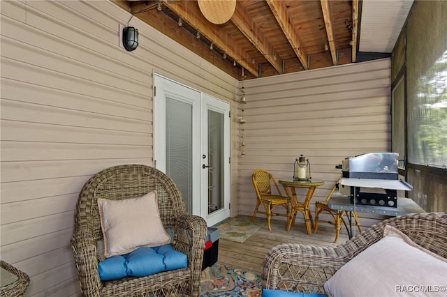 exterior space featuring beamed ceiling and wood ceiling