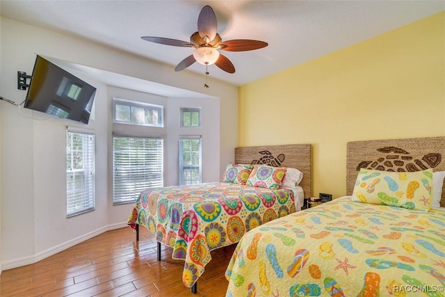 bedroom with hardwood / wood-style flooring and ceiling fan