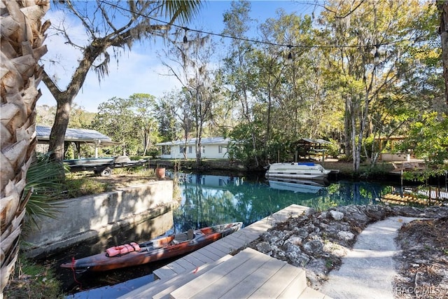 view of pool featuring a water view