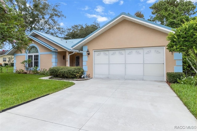 single story home with a front yard and a garage