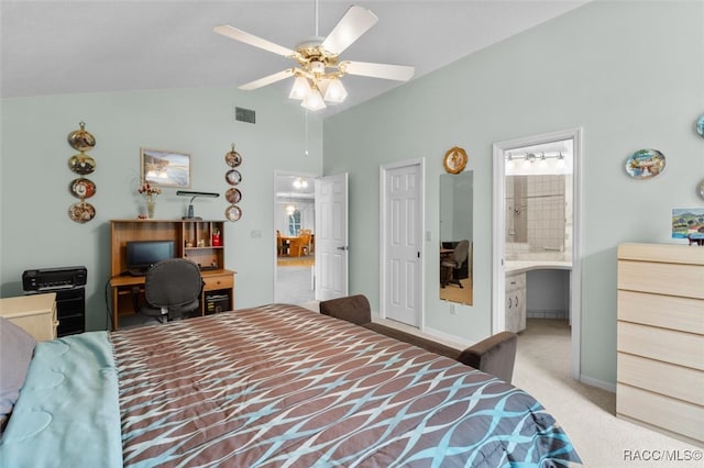 carpeted bedroom featuring connected bathroom, ceiling fan, and vaulted ceiling