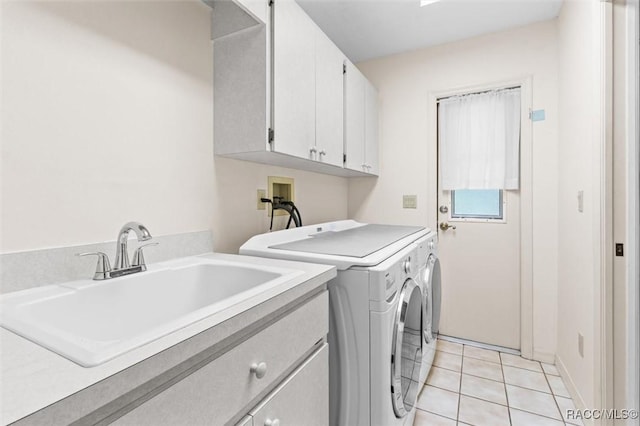 25 Redbay Ct W, Homosassa, FL 34446 - laundry room with cabinet space, washing machine and dryer, and light tile patterned flooring
