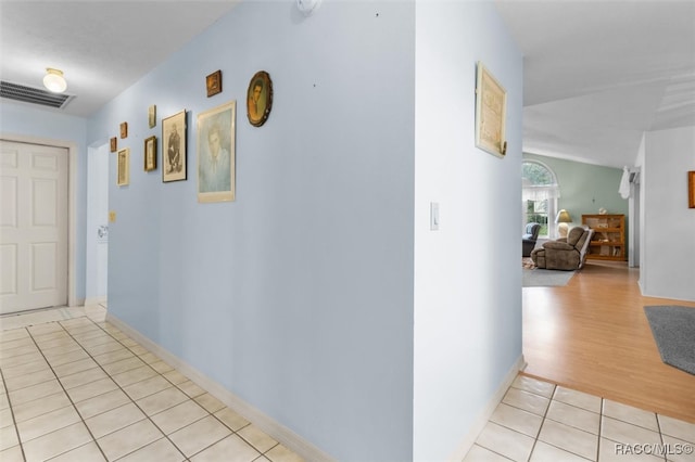 corridor with light wood-type flooring