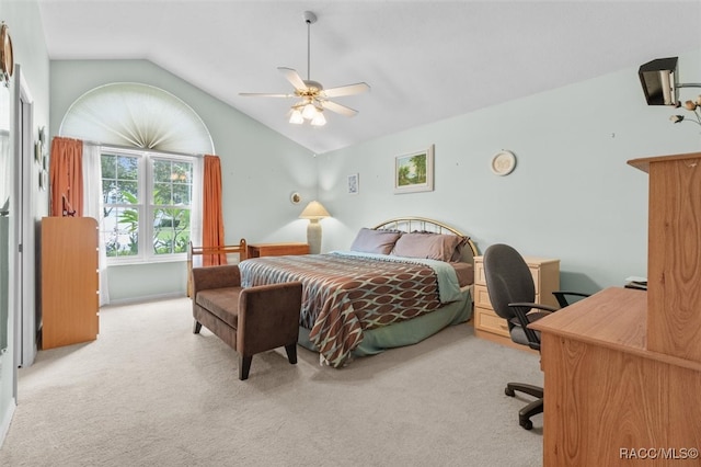 carpeted bedroom with ceiling fan and lofted ceiling