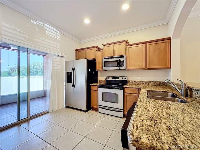 kitchen featuring light tile patterned floors, ornamental molding, sink, and appliances with stainless steel finishes