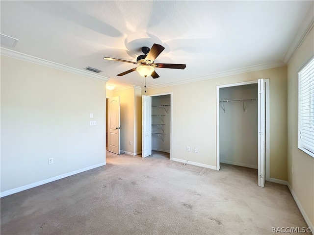 unfurnished bedroom featuring ceiling fan, light carpet, and ornamental molding