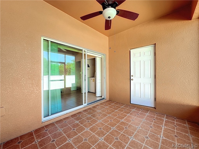 view of patio with ceiling fan and washer / dryer