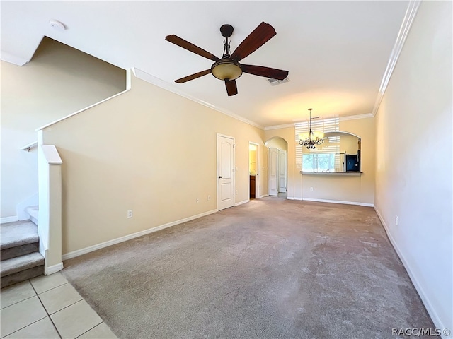 unfurnished living room featuring light carpet, ceiling fan with notable chandelier, and ornamental molding