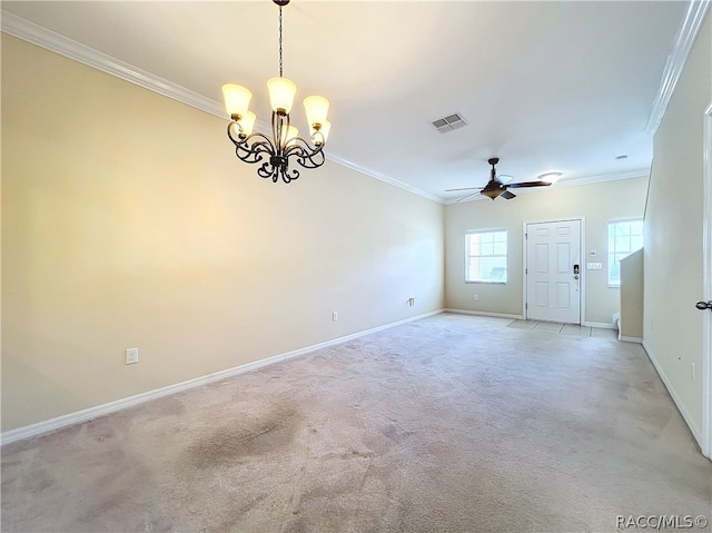 carpeted spare room with ceiling fan with notable chandelier and ornamental molding