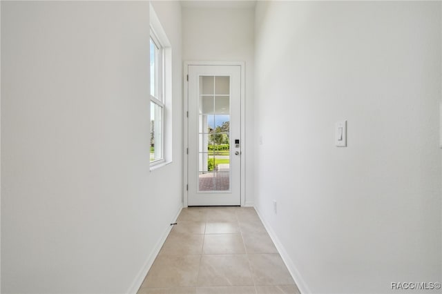 doorway to outside featuring light tile patterned floors