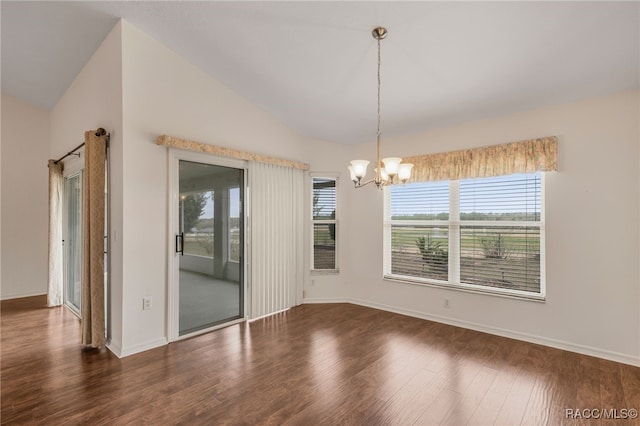 spare room with dark wood-style floors, baseboards, vaulted ceiling, and an inviting chandelier