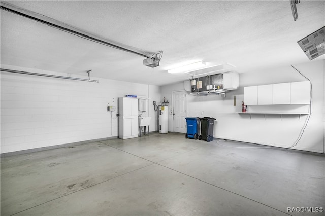 garage featuring a garage door opener and electric water heater