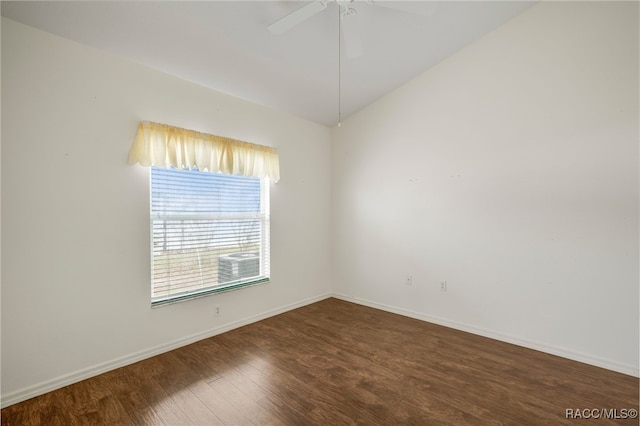 unfurnished room featuring ceiling fan, baseboards, vaulted ceiling, and wood finished floors