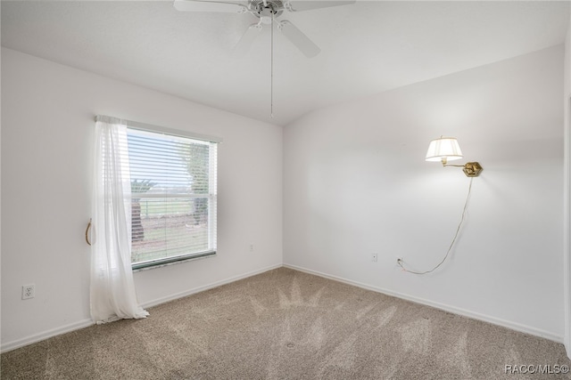 unfurnished room with baseboards, a ceiling fan, and carpet flooring