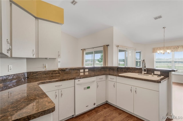 kitchen featuring plenty of natural light, visible vents, dishwasher, and a sink