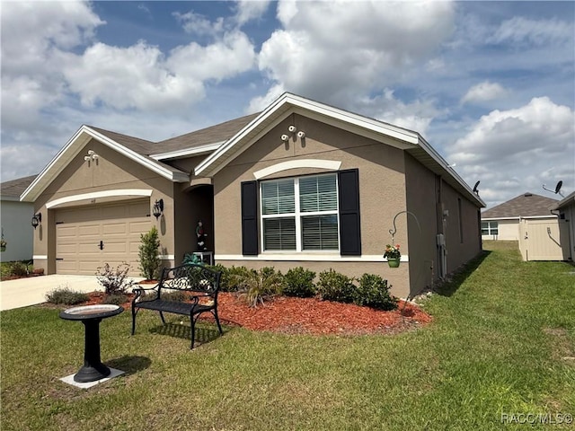 ranch-style home with an attached garage, driveway, a front yard, and stucco siding