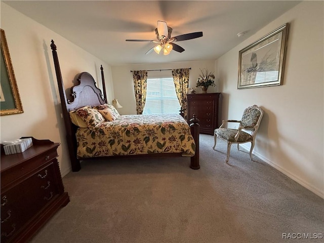 carpeted bedroom featuring a ceiling fan and baseboards