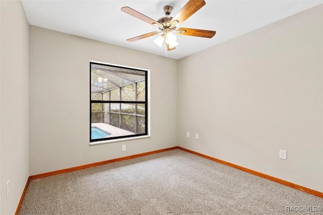 empty room with carpet flooring and ceiling fan