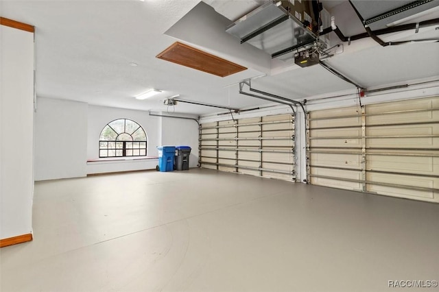 garage featuring a garage door opener