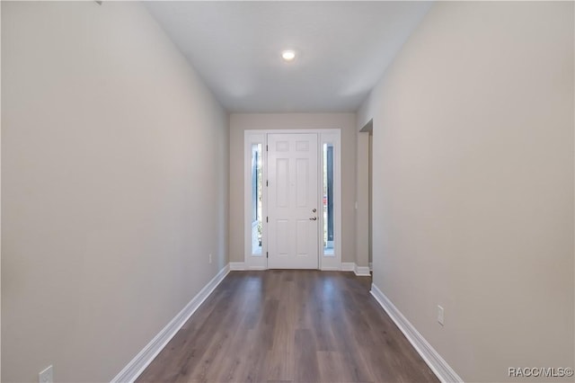 doorway with dark hardwood / wood-style floors