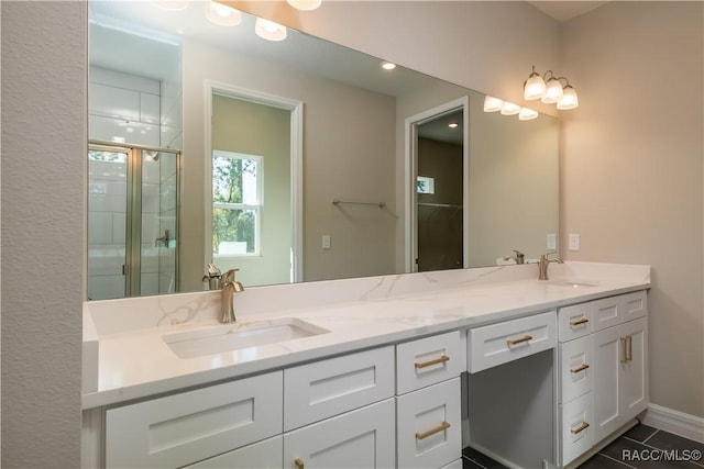 bathroom with vanity and an enclosed shower