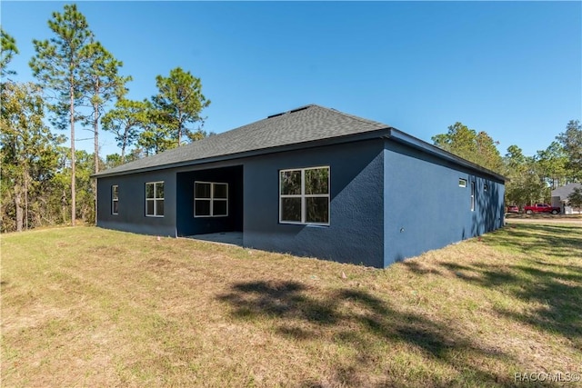 view of property exterior with a lawn