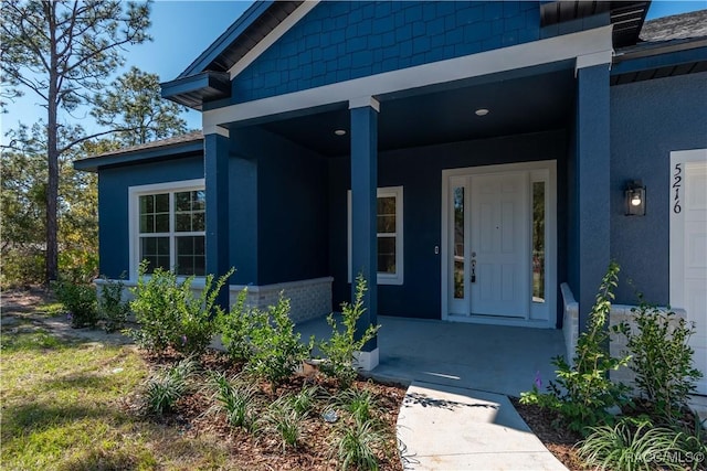 property entrance with a porch