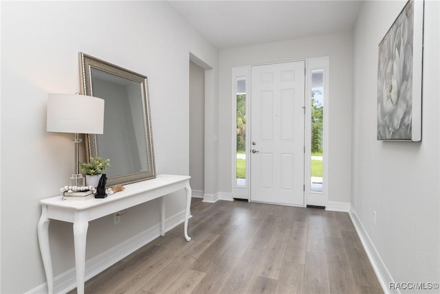 foyer entrance with light hardwood / wood-style floors