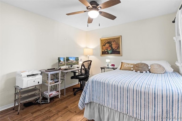 bedroom featuring hardwood / wood-style flooring and ceiling fan