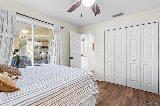 bedroom featuring ceiling fan, dark hardwood / wood-style floors, access to exterior, and a closet