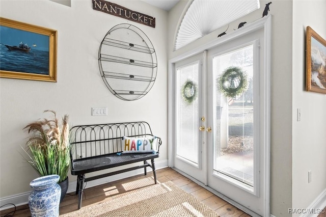 entrance foyer featuring hardwood / wood-style floors and french doors