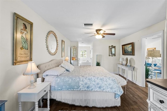 bedroom with dark hardwood / wood-style floors and ceiling fan