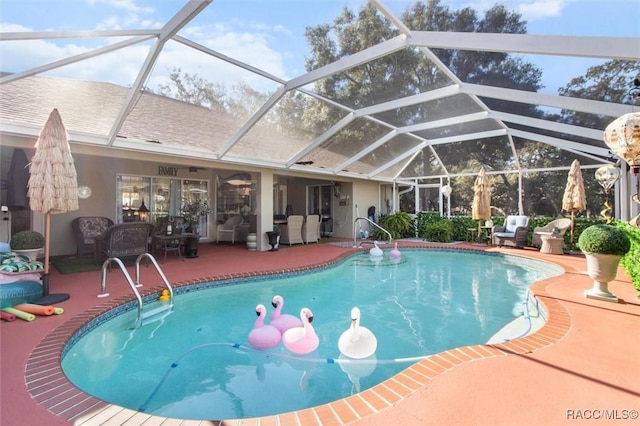 view of swimming pool with a lanai, an outdoor living space, and a patio area